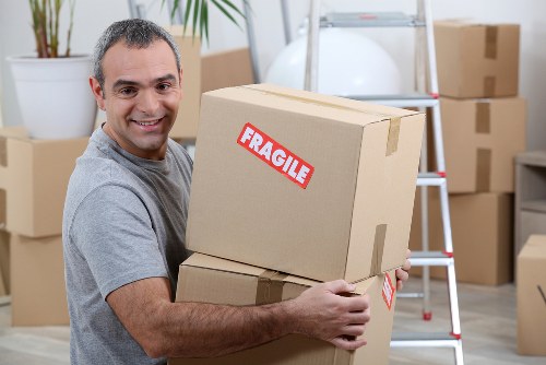 Furniture pick-up service helping remove bulky items from a Shepherds Bush home