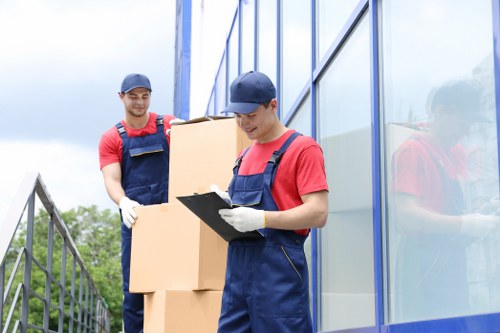 Local home moving service in Shepherds Bush with packed boxes and moving van