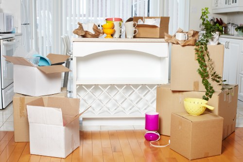 Removal team handling home move boxes in Shepherds Bush