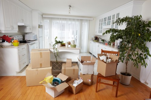 Boxes and furniture being loaded for a student move in West London