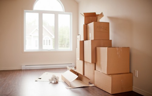 Professional removals team handling furniture in a Shepherds Bush home move