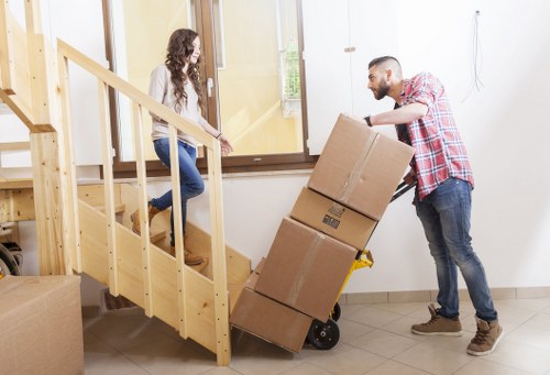 Packed office furniture ready for transport in West London